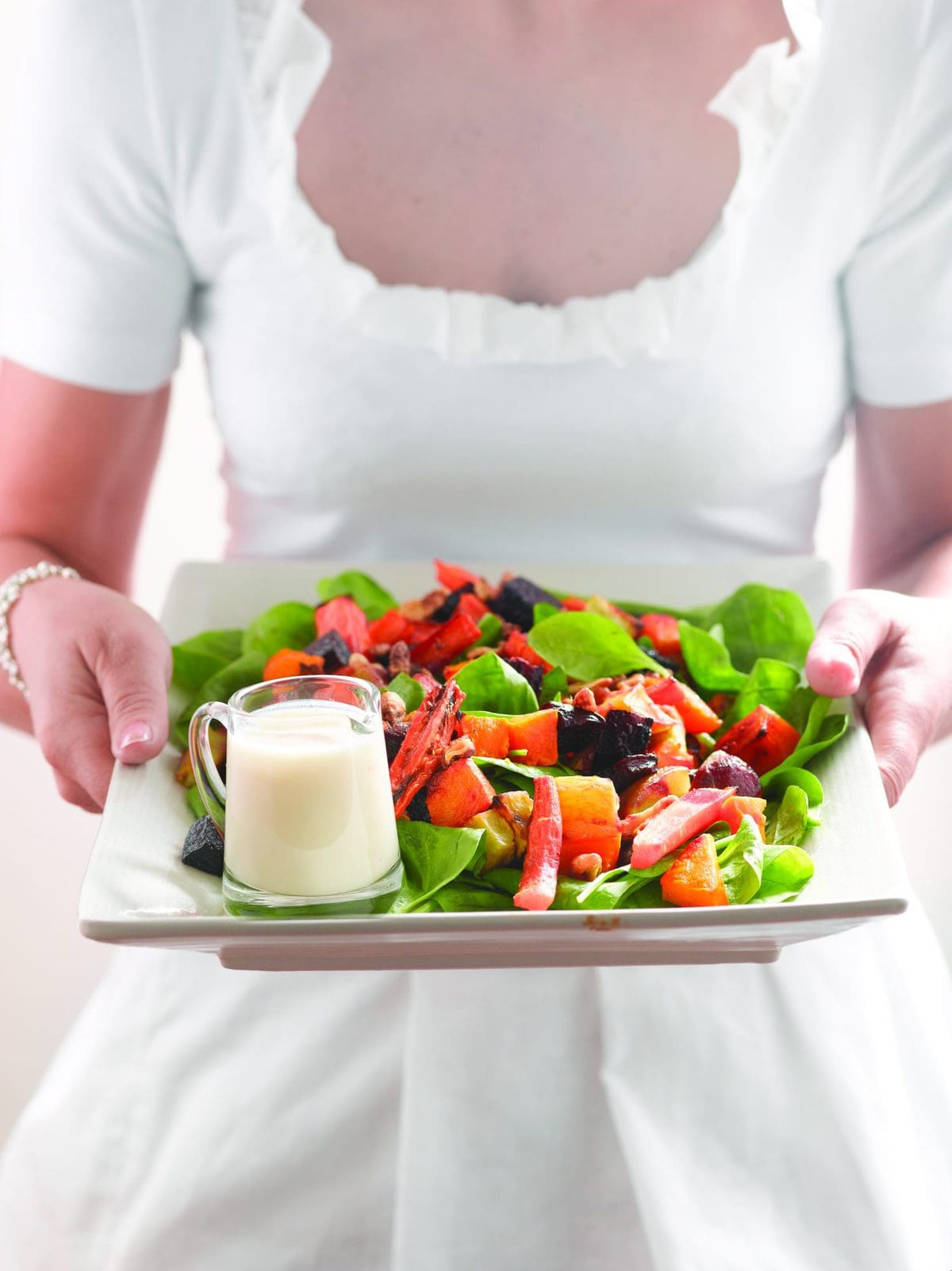 Roasted vegetable salad with walnuts and orange dressing