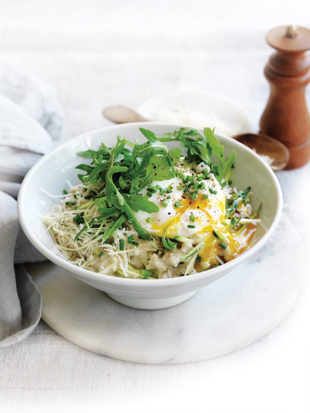 Savoury porridge with zucchini, parmesan, rocket and poached egg