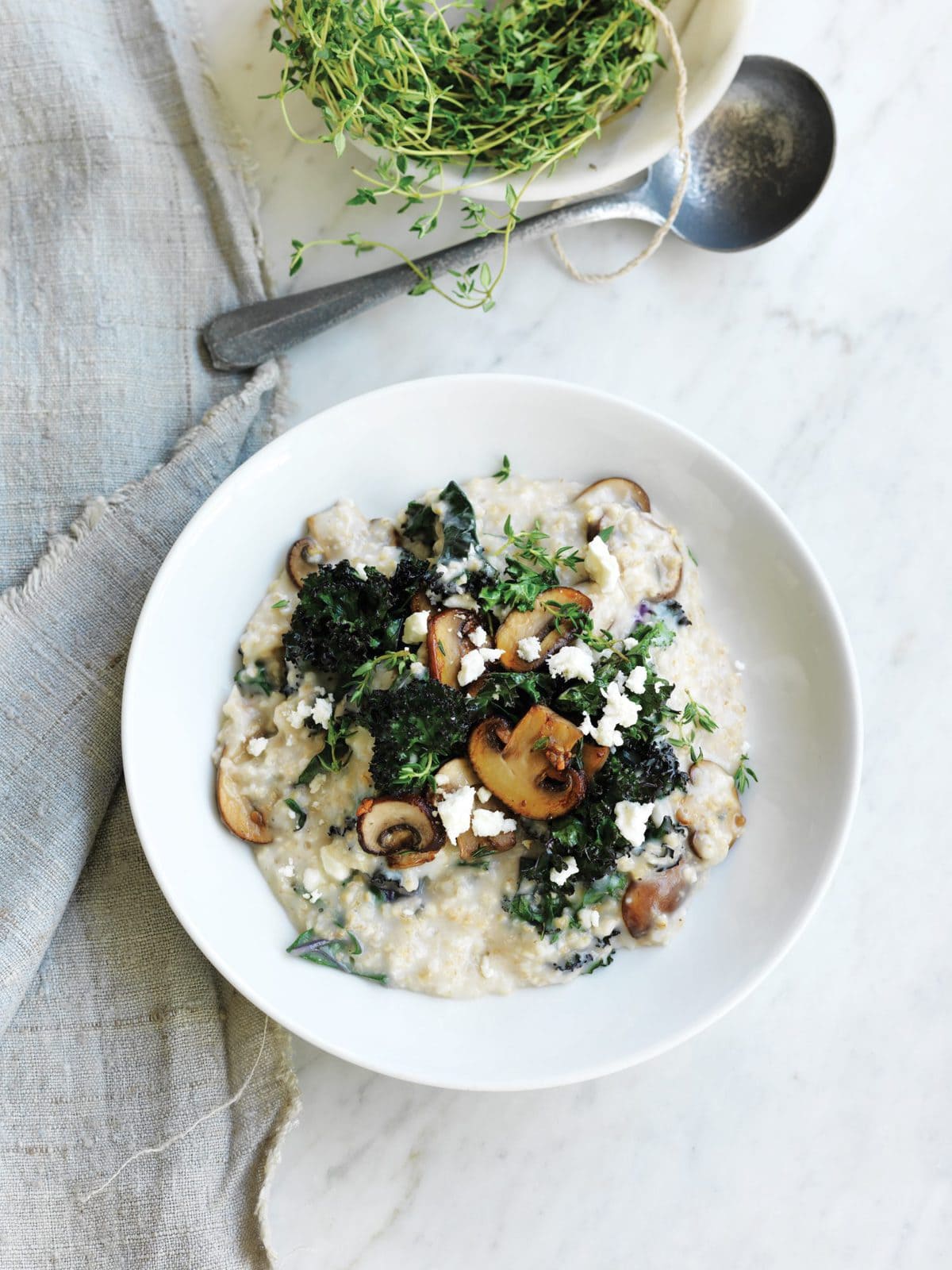 Savoury porridge with mushrooms, thyme, feta and kale