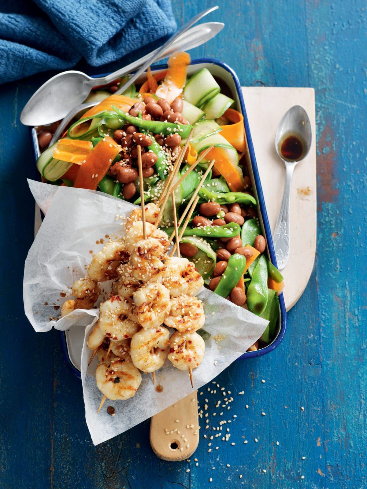 Sesame prawn skewers with borlotti bean and snow pea salad