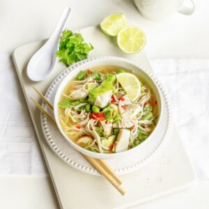 Soba noodle soup with fish and Asian greens