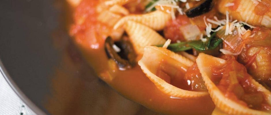 Spinach and black olive sauce with pasta