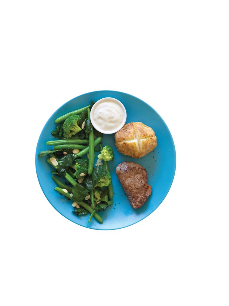 Steak with horseradish cream, baked potato and greens Steak with horseradish cream, baked potato and greens