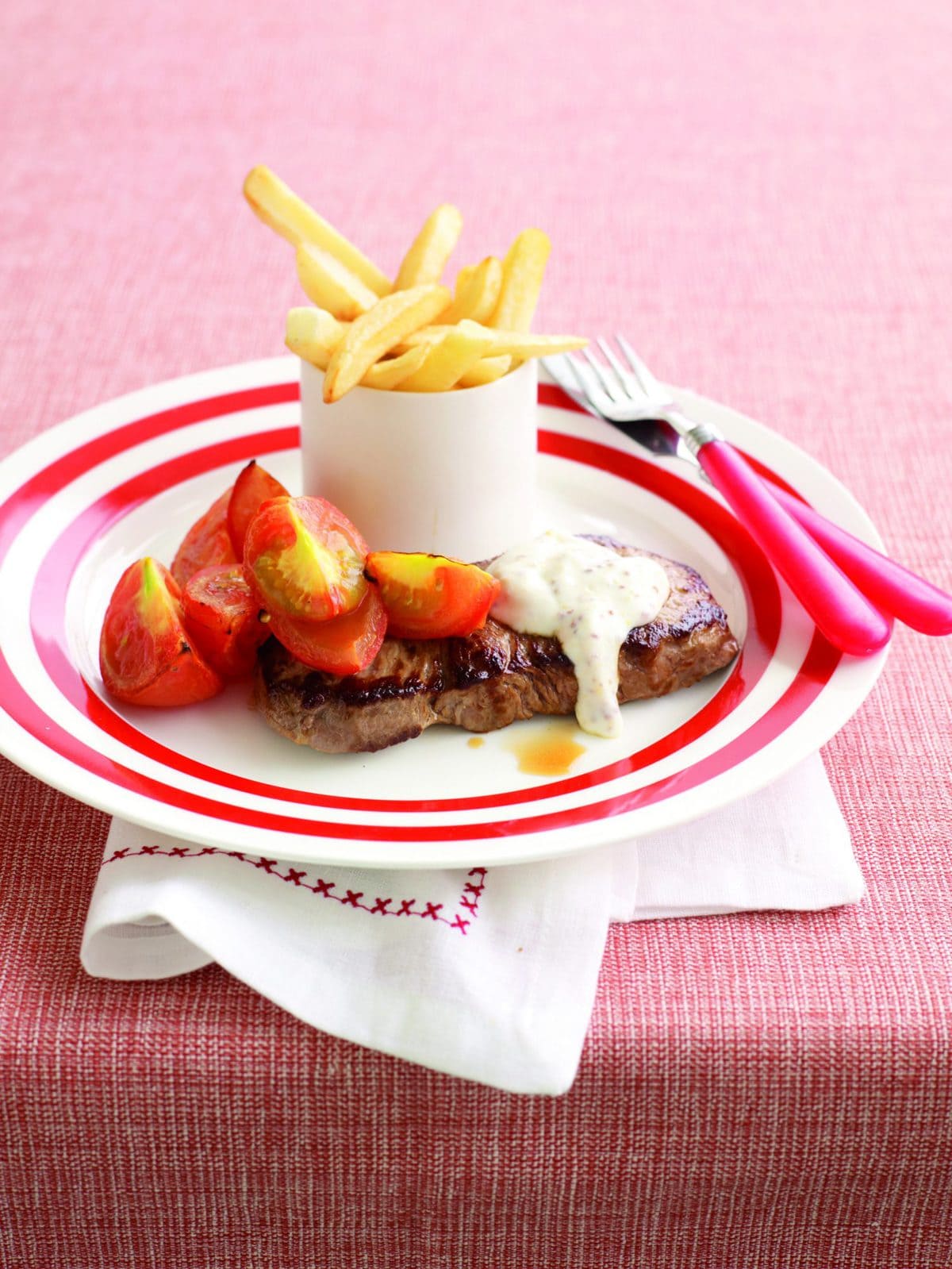 Steak with creamy mustard sauce and oven chips
