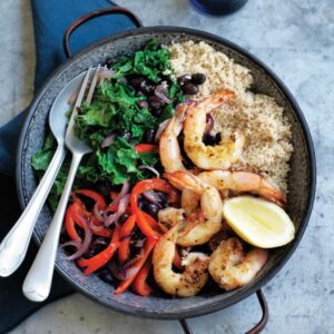 Warm black bean and kale couscous with grilled prawns