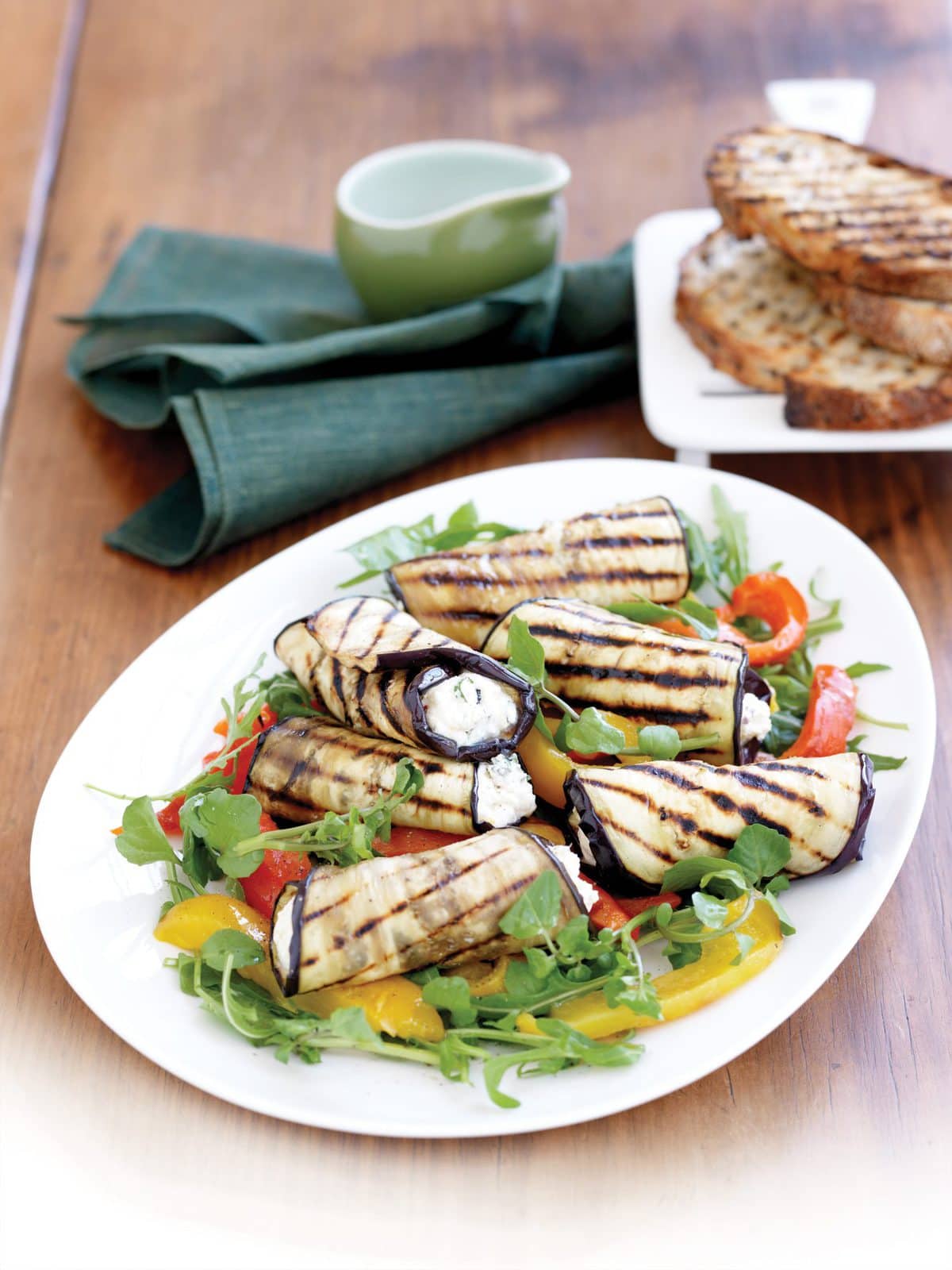 Warm eggplant rolls with herbed ricotta filling