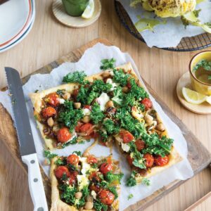 Roasted whole cauliflower with tomato, fennel and chickpea galette