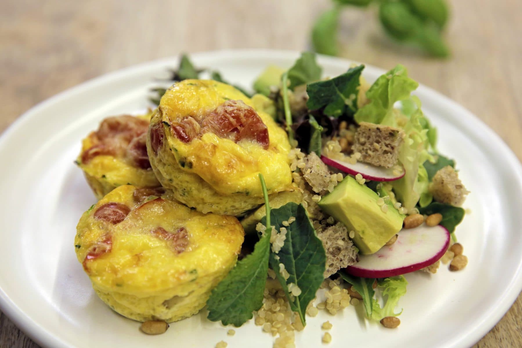 Courgette and tomato frittatas with avocado, quinoa and radish salad