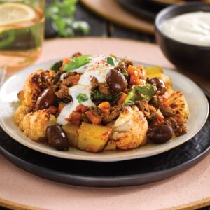 Lamb with olives, spiced cauliflower and potatoes