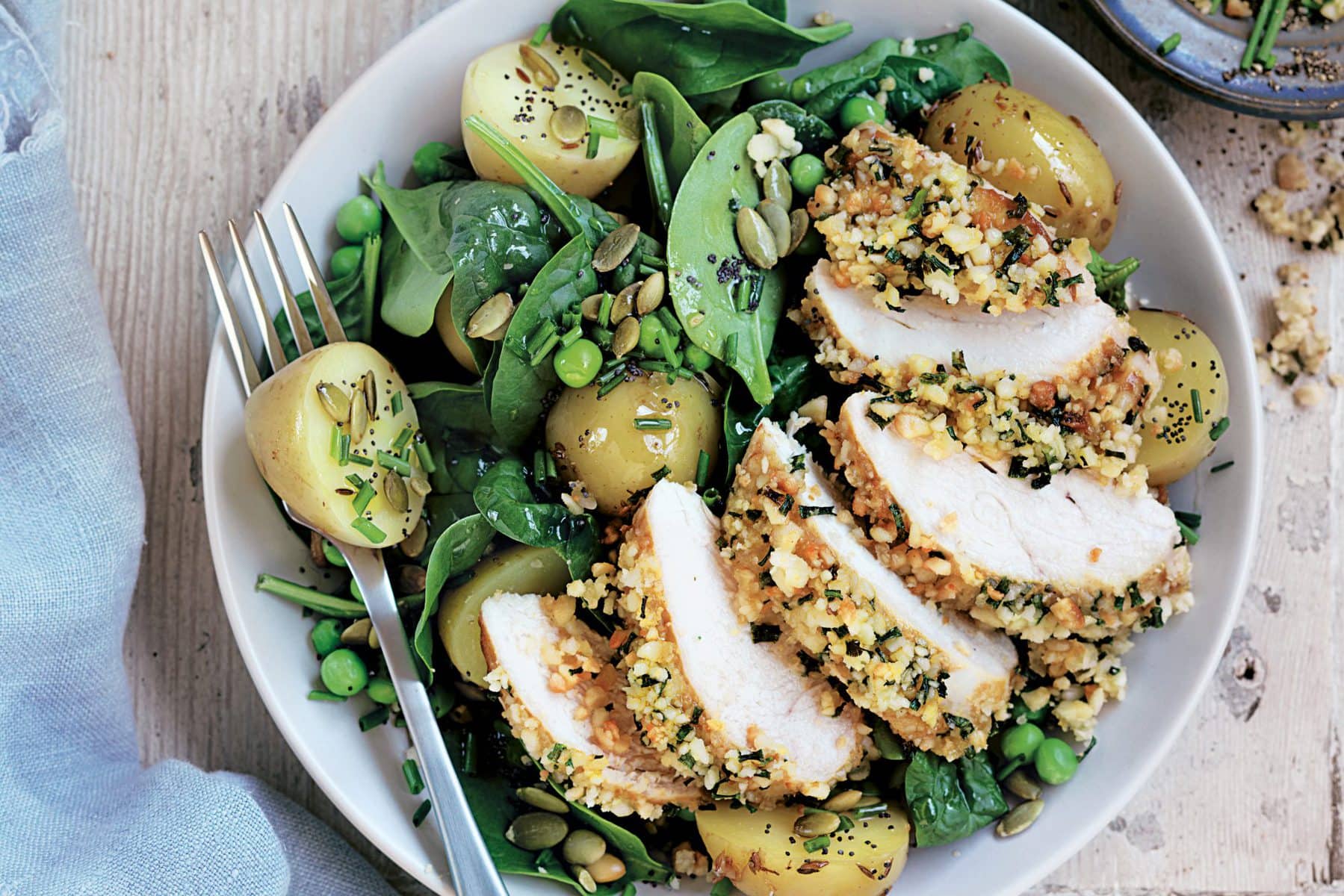 Macadamia-crusted chicken with potato salad