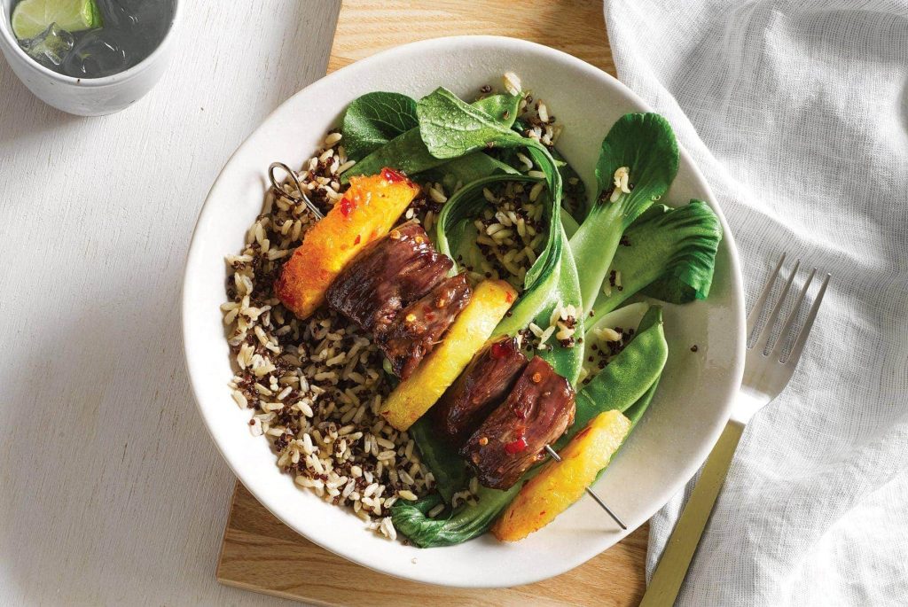 Sticky lamb kebabs with greens