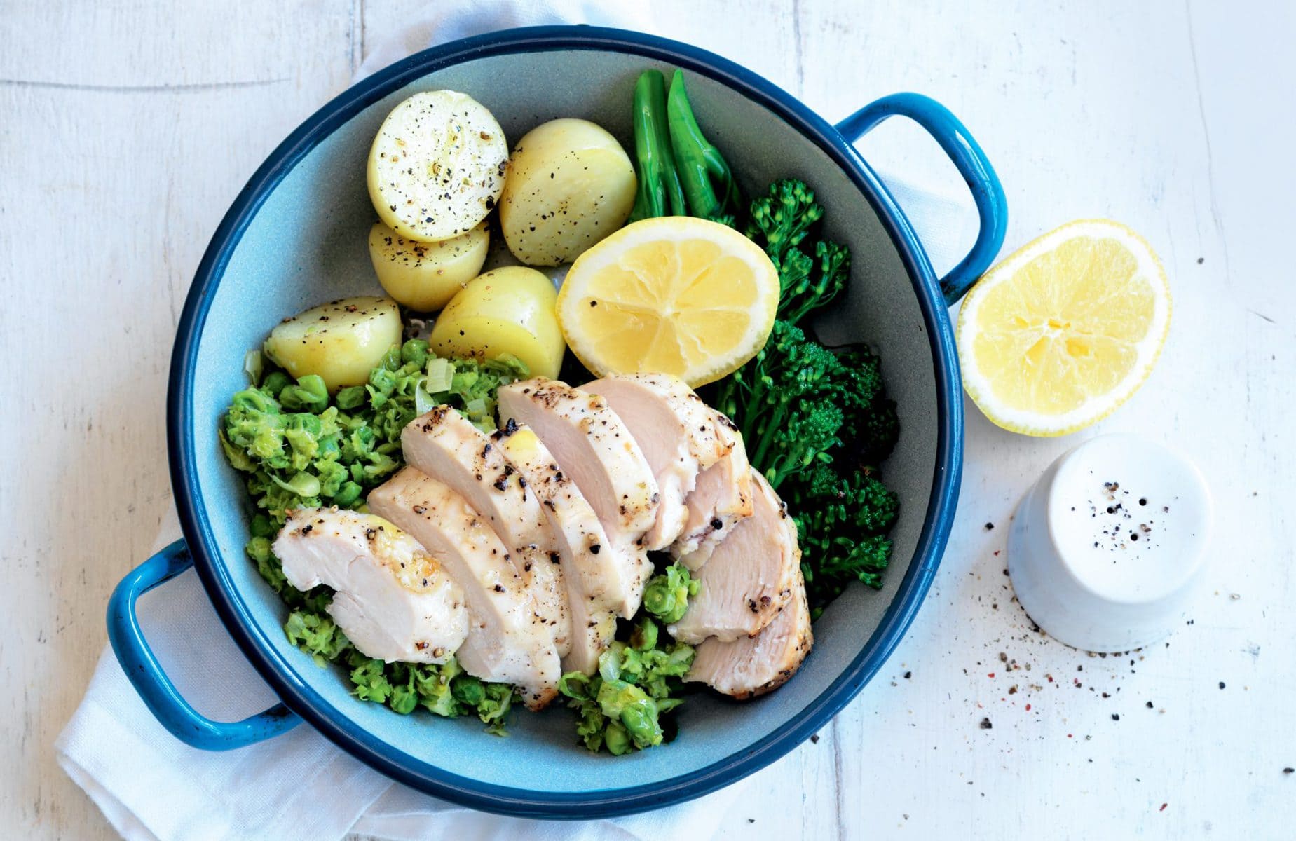 Garlicky roast chicken with mashed lemon peas