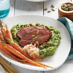 Lamb with broad bean purée and roasted baby carrots