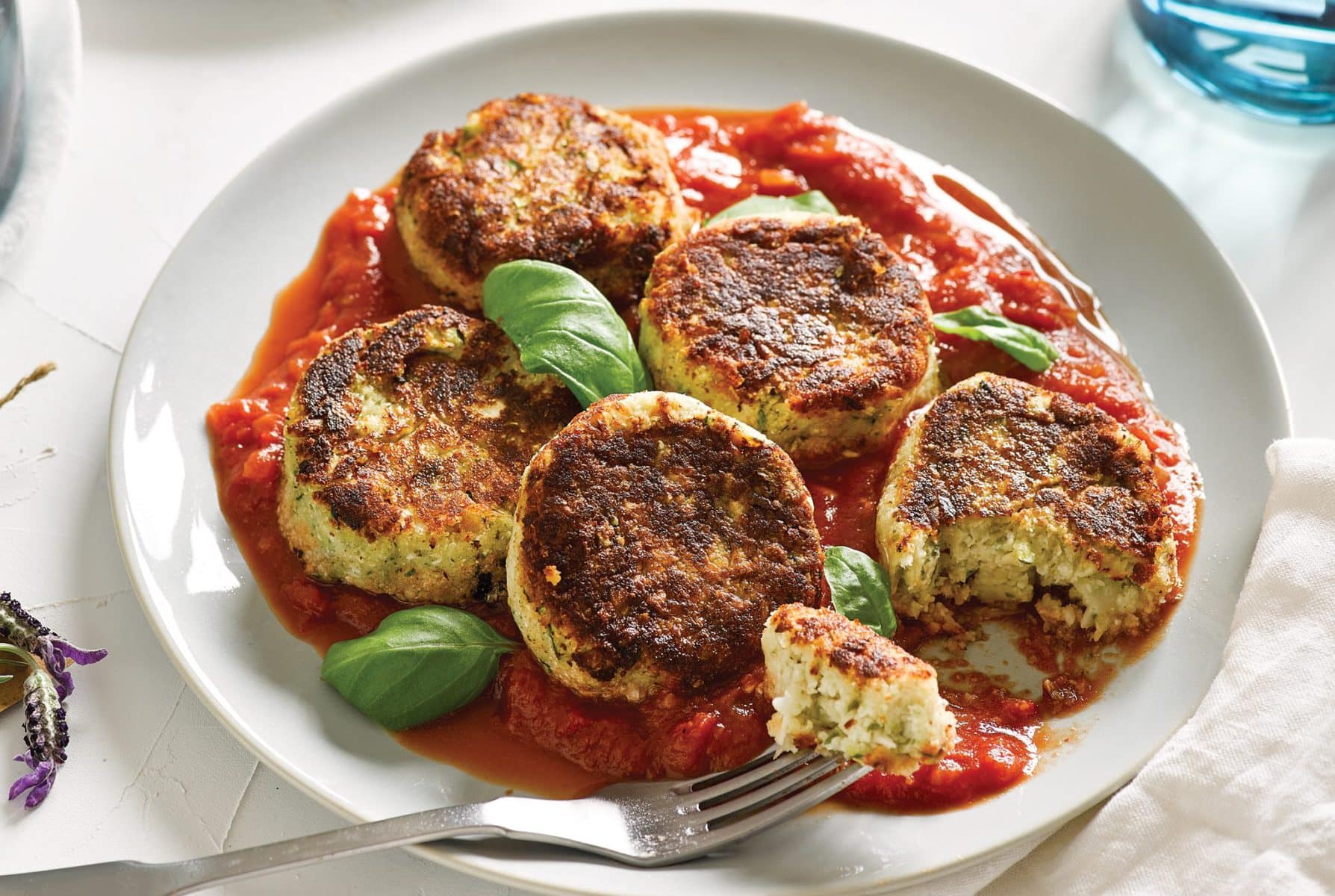 White bean, cauli and zucchini patties with spicy tomato and basil sauce