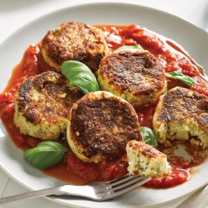White bean, cauli and zucchini patties with spicy tomato and basil sauce