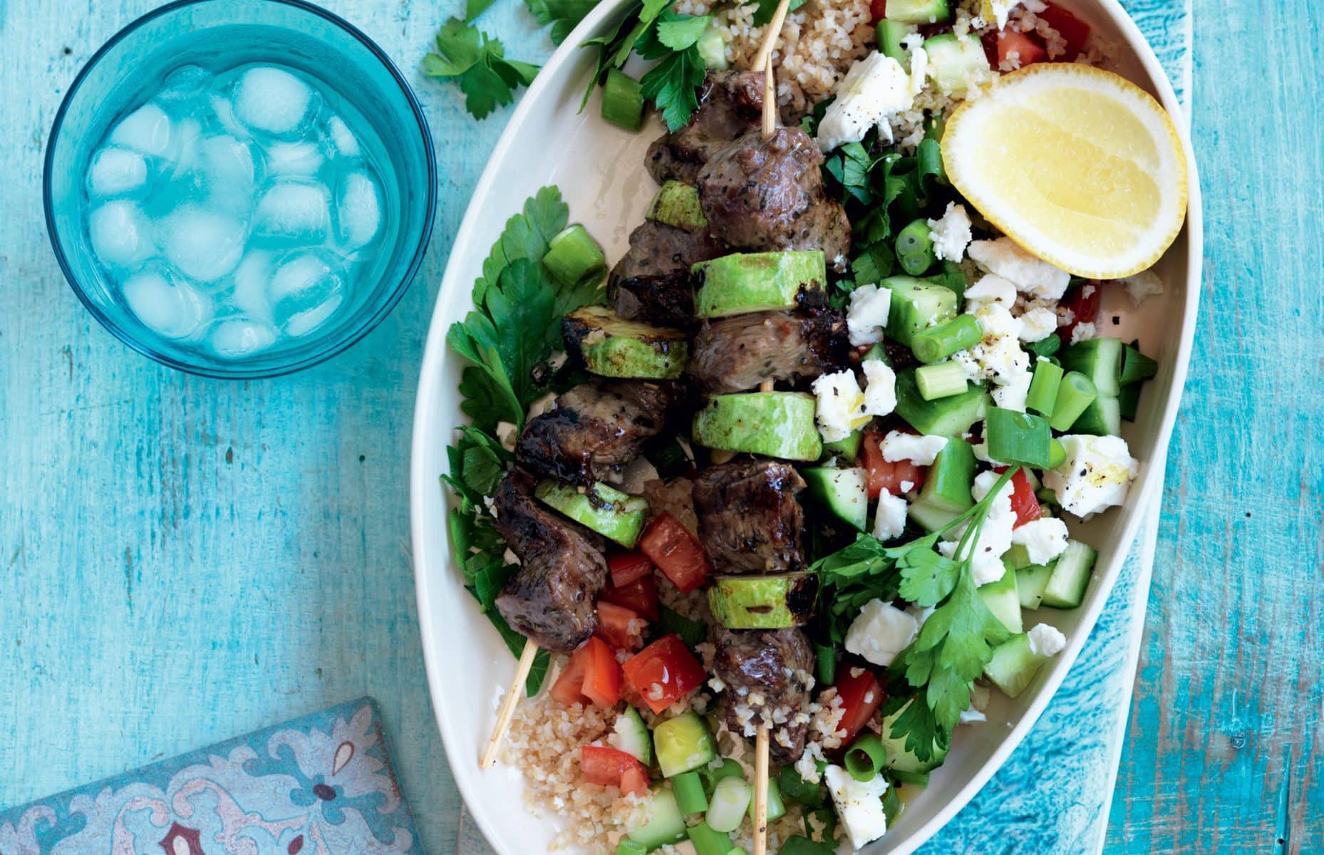 Lamb souvlaki with bulgar, tomato and feta salad