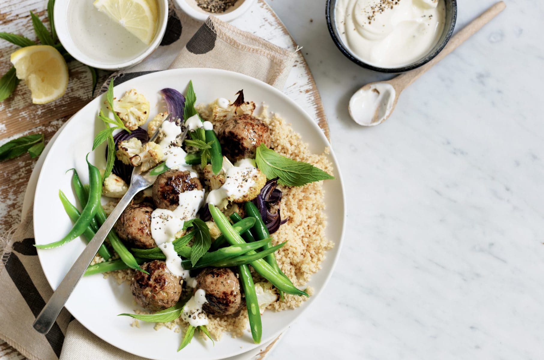 Spiced lamb meatballs with baked cauliflower salad