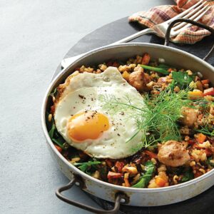 Vegetable and sausage pilaf with egg