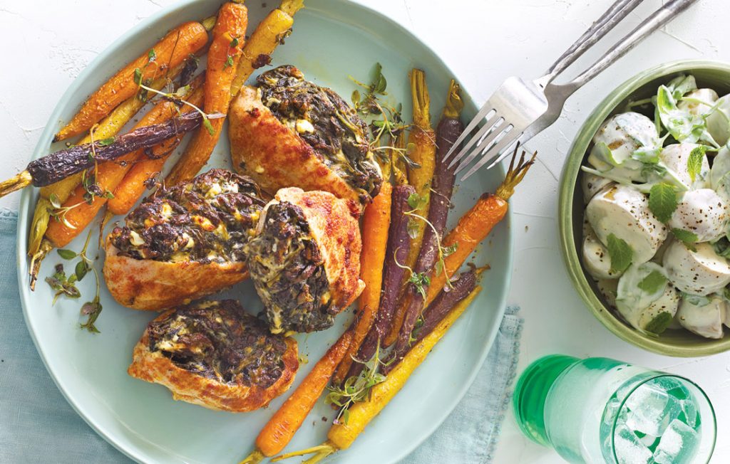 Stuffed chicken breast with baby carrots and creamy potato salad