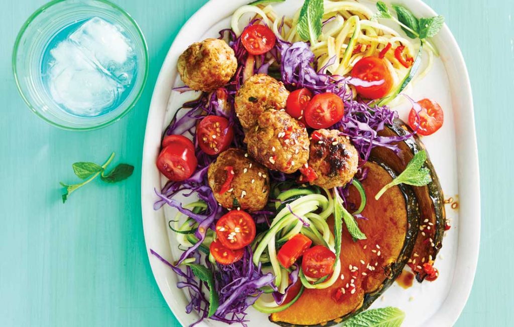 Spicy pork meatballs with roasted pumpkin and cabbage salad