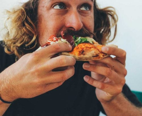 Man eating pizza