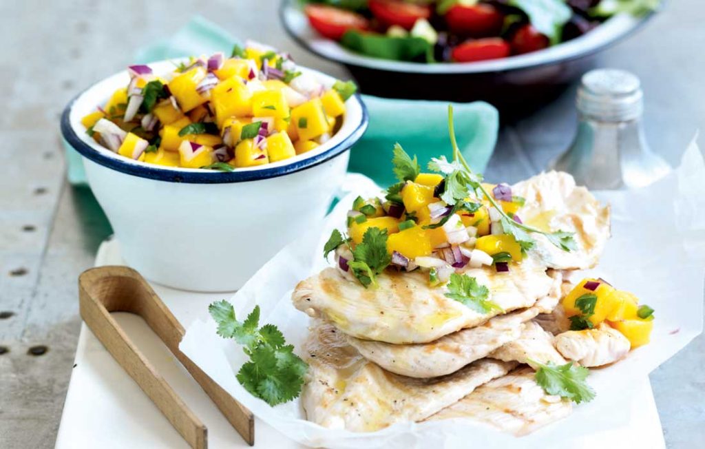 Grilled chicken with mango salsa and bean salad