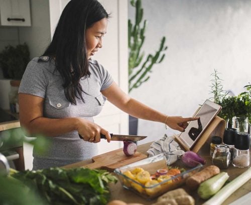 Asian woman cooking a meal