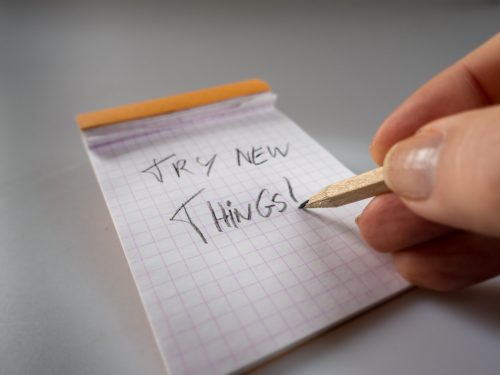 Person writing try new things