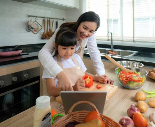 mother and daughter cooking