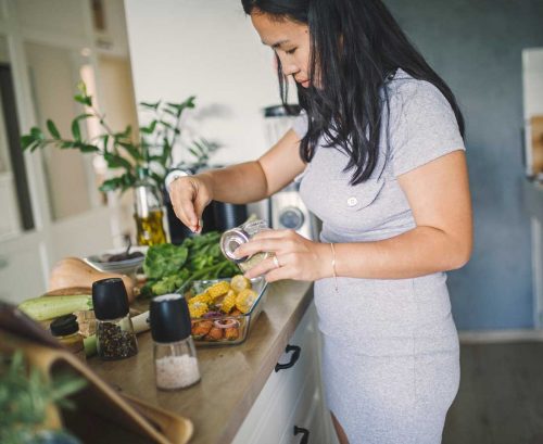 Woman preparing health vegetables in kitchen