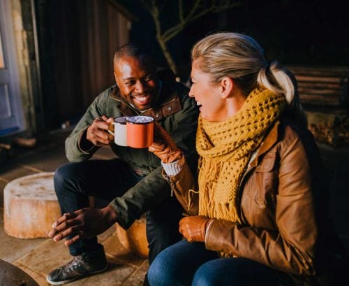 Healthy man and woman drinking tea in their 40s