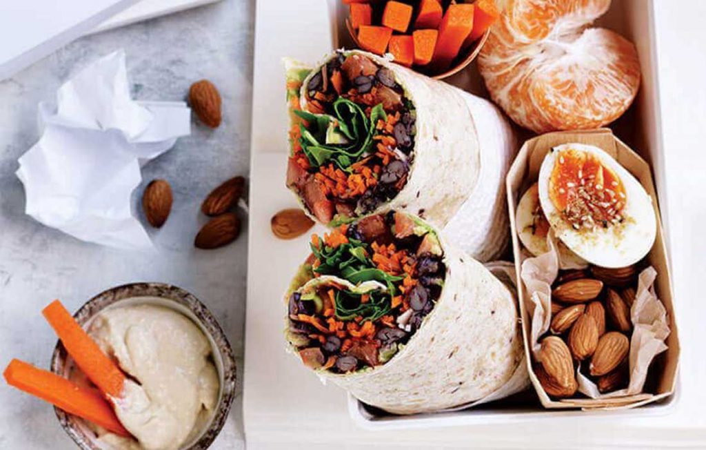 Smashed black bean, avocado and rocket wraps