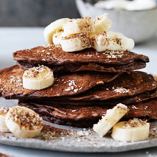 Chocolate pancakes with coconut and bananas