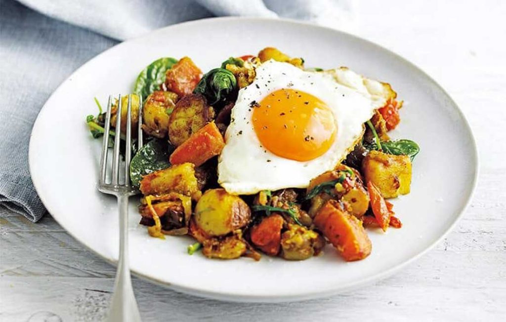Indian-spiced bubble and squeak with fried eggs Indian-spiced bubble and squeak with fried eggs