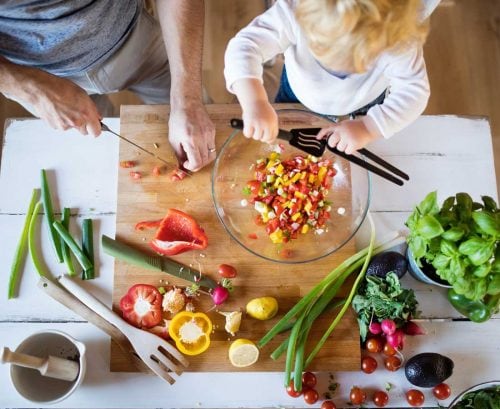 Father and baby cooking