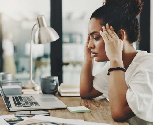 Women looking stressed at her computer