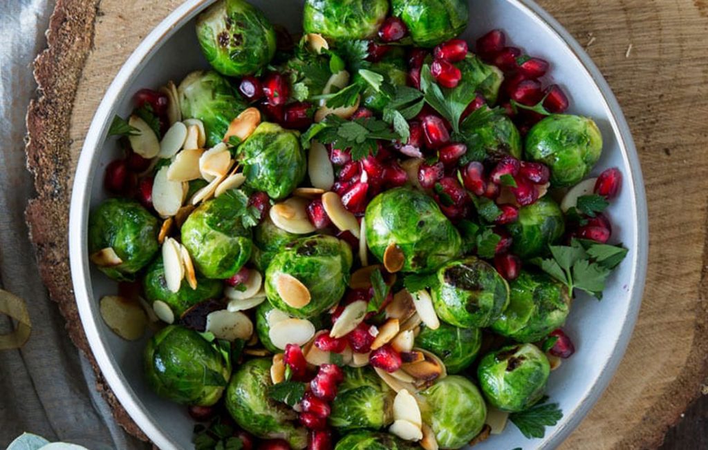 Pomegranate brussels sprouts with flaked almonds