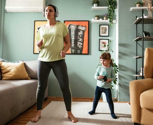 Mother and daughter exercising at home