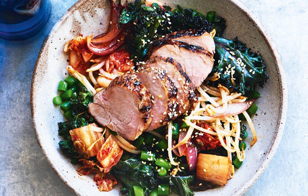 Roasted pork with warm kimchi and kale salad