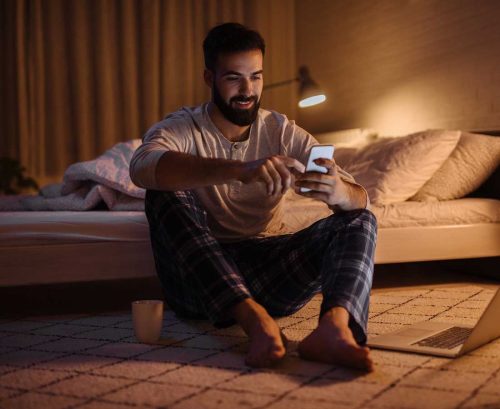 Man up at night on his phone