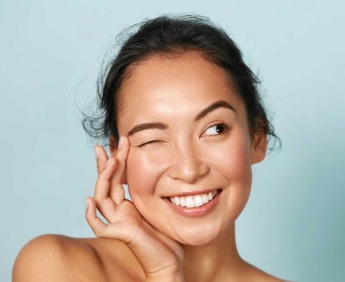Winking woman with healthy eyes