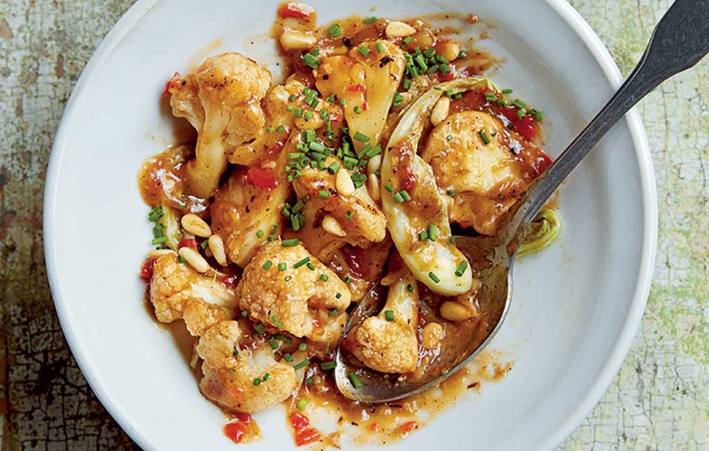 Wok-fried cauliflower with honey soy hoisin and pine nuts