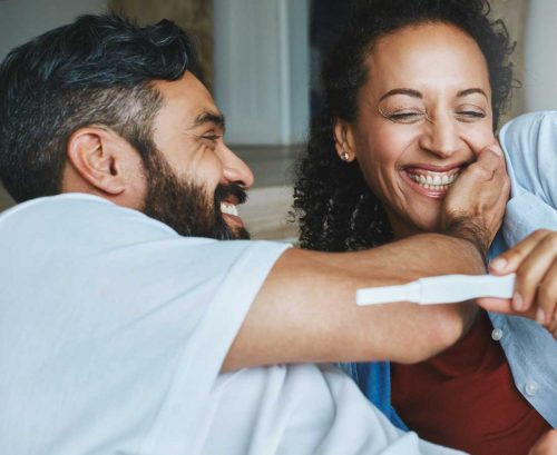Couple excited by pregnancy test