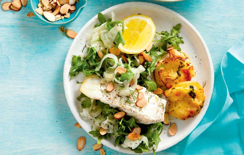 Crunchy smashed potatoes with fish and fennel