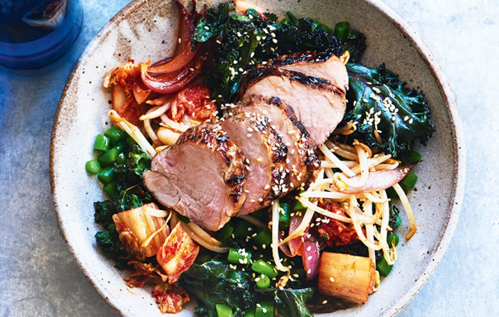 Roasted pork with warm kimchi and kale salad