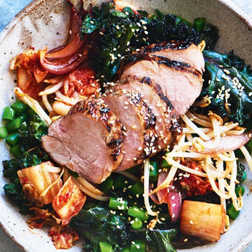 Roasted pork with warm kimchi and kale salad