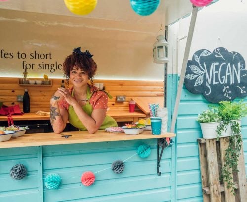 Smiling woman in a vegan food truck