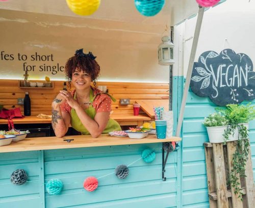 Smiling woman in a vegan food truck
