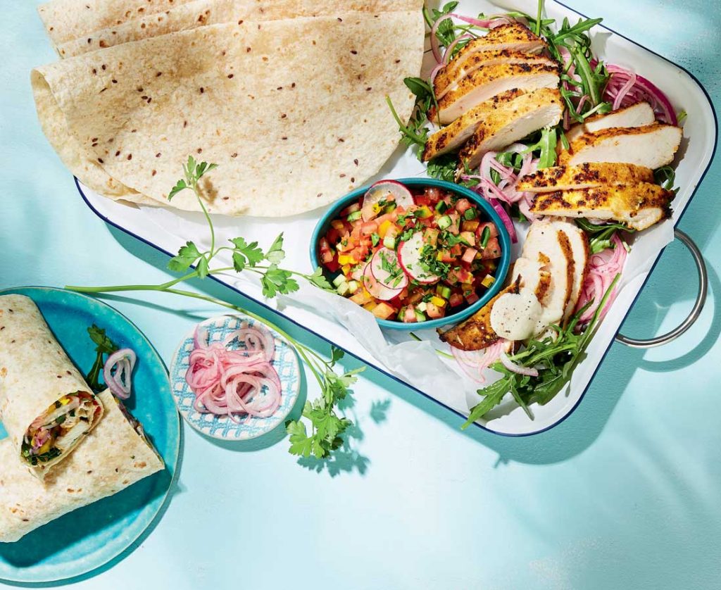 Chicken shawarma wraps with quick pickled onions and tahini sauce Chicken shawarma wraps with quick pickled onions and tahini sauce