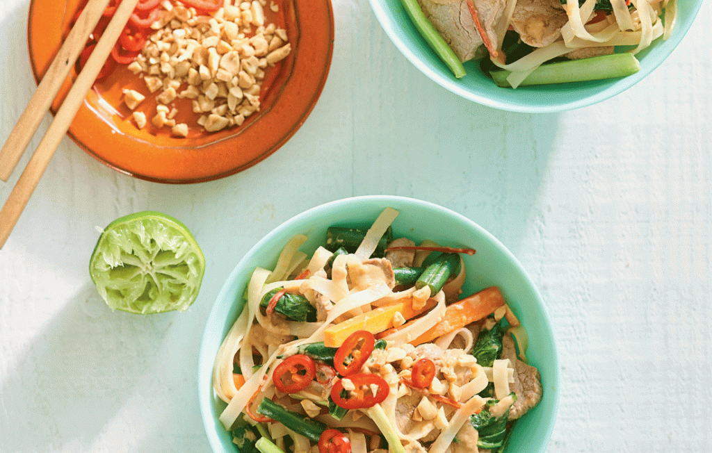 Stir-fried pork with rice noodles, peanuts and choy sum